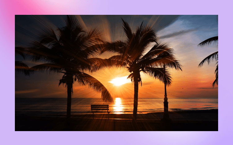 Tranquil tropical beach scene with palm trees silhouetted against a sunset, evoking a sense of paradise that one may aspire to through spiritual practices.