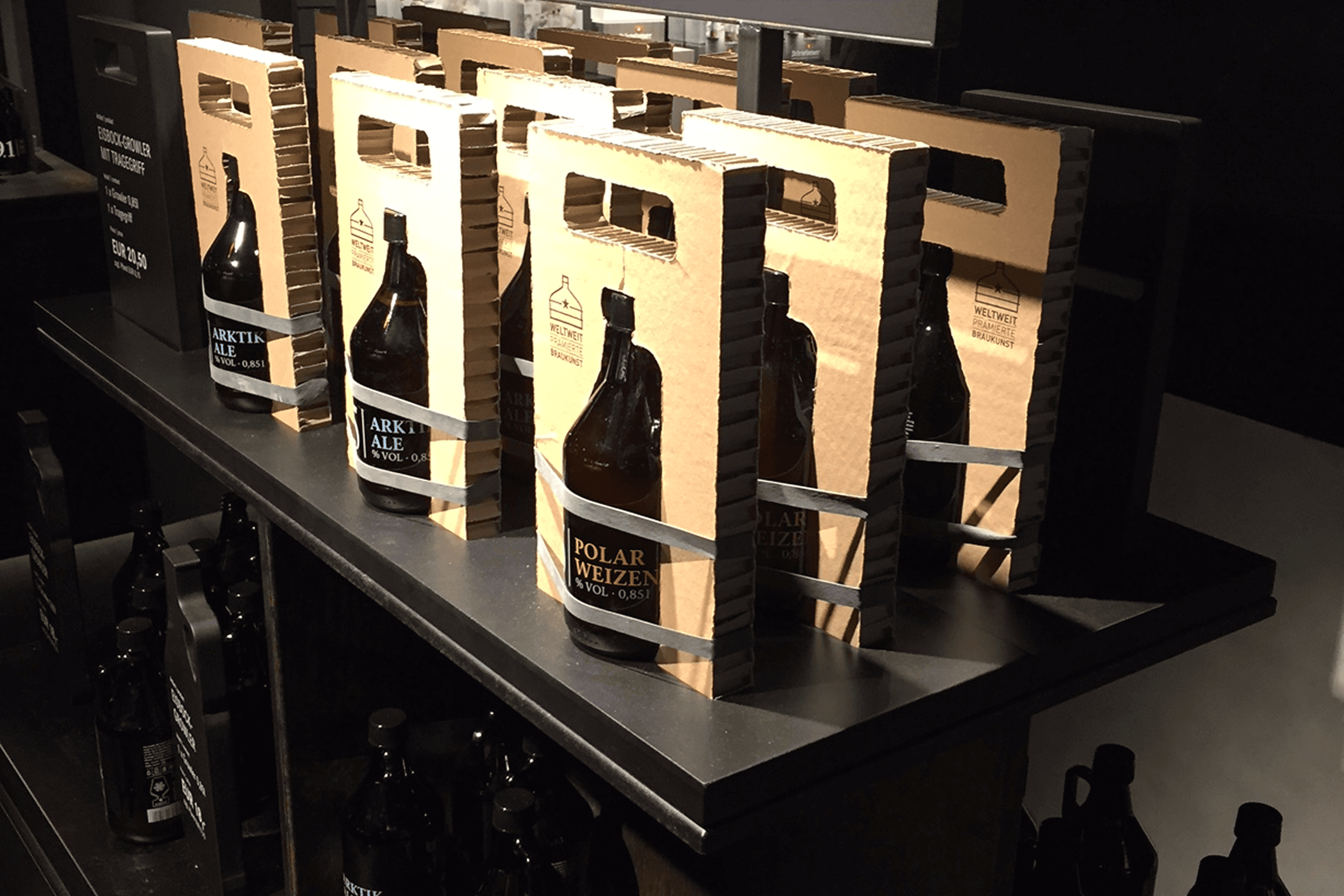 Beer bottles in cardboard carriers.
