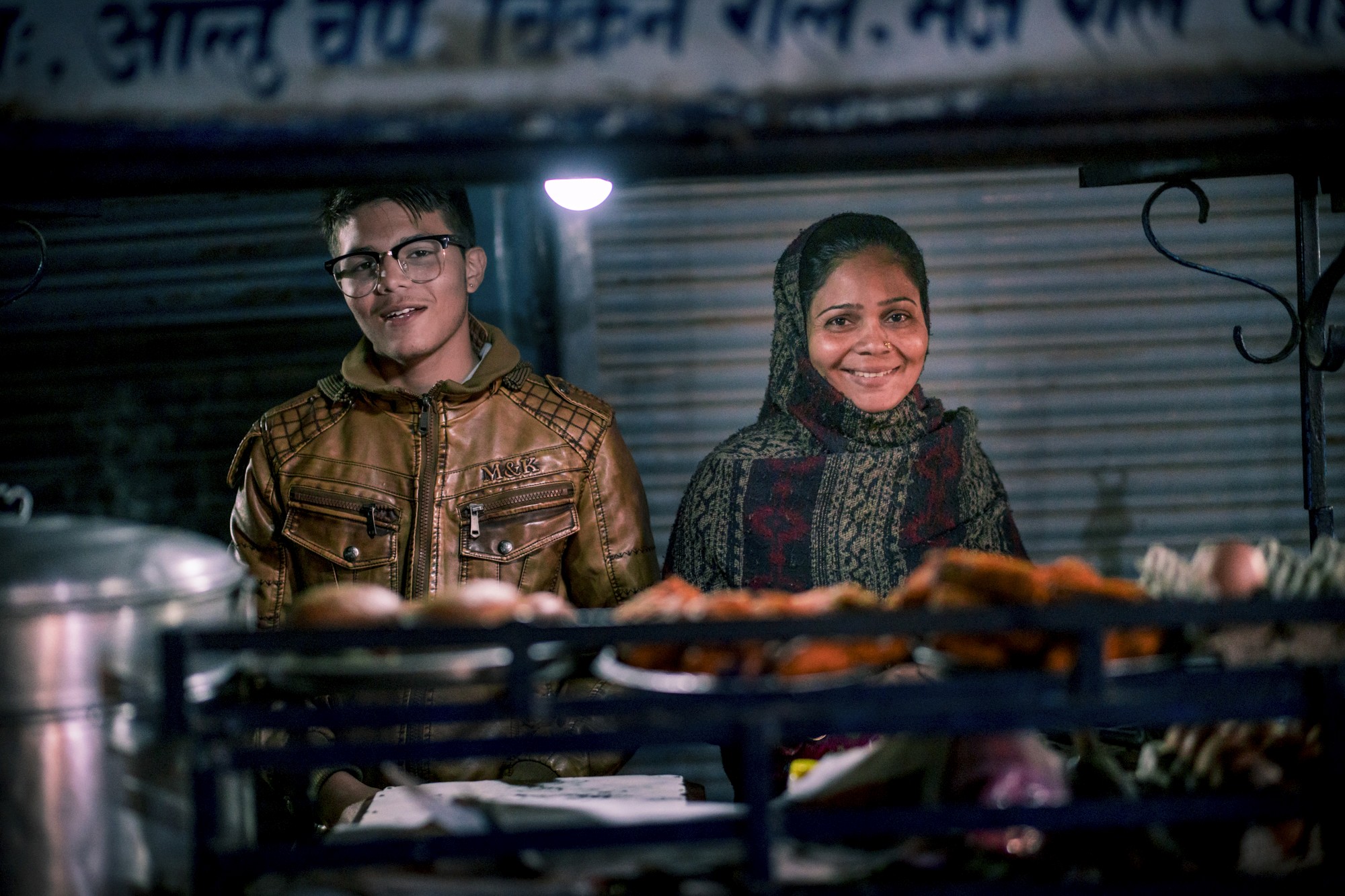 Two people selling chicken on the streets of Kathmandu