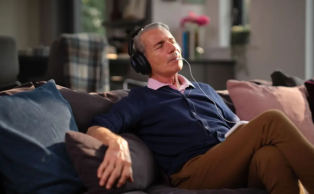 Doctor checking a male patient's hearing