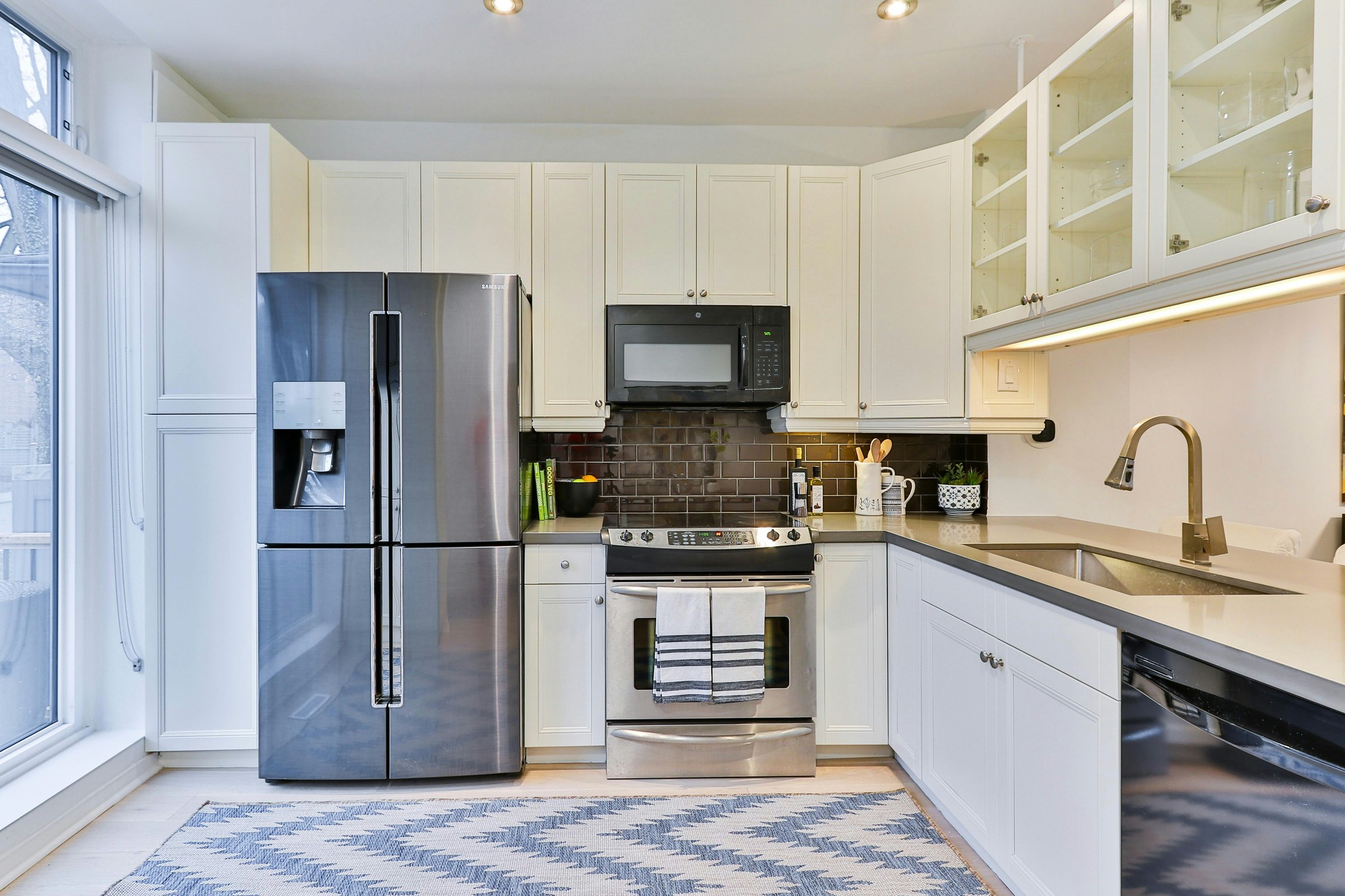 A kitchen setup with electrical appliances being installed.