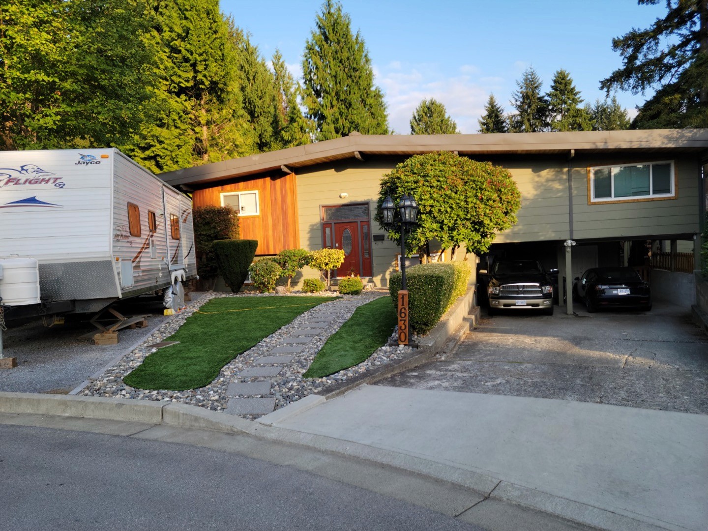 people in black academic dress standing on green grass field during daytime
