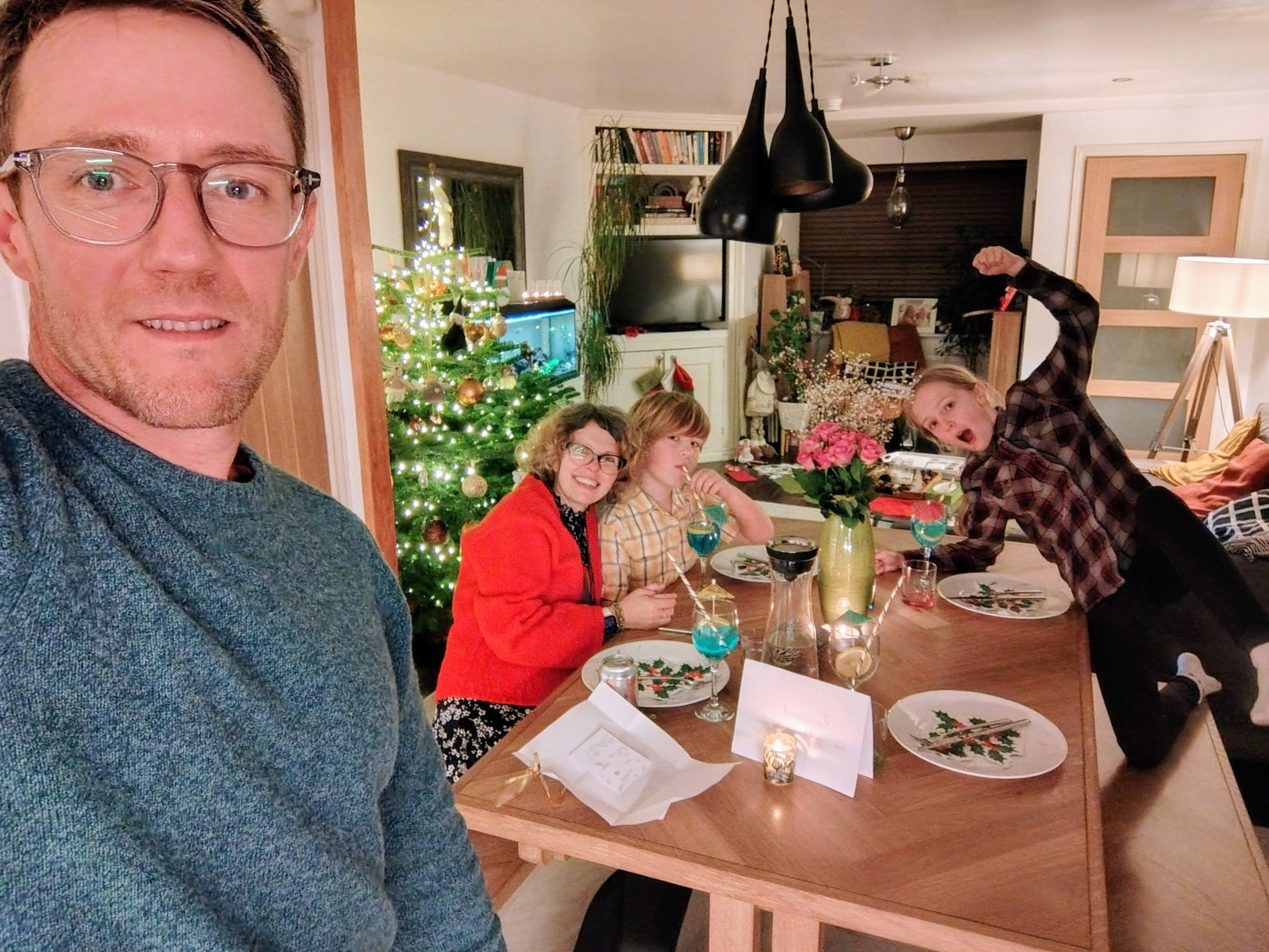 A formal dining room table set for a meal.