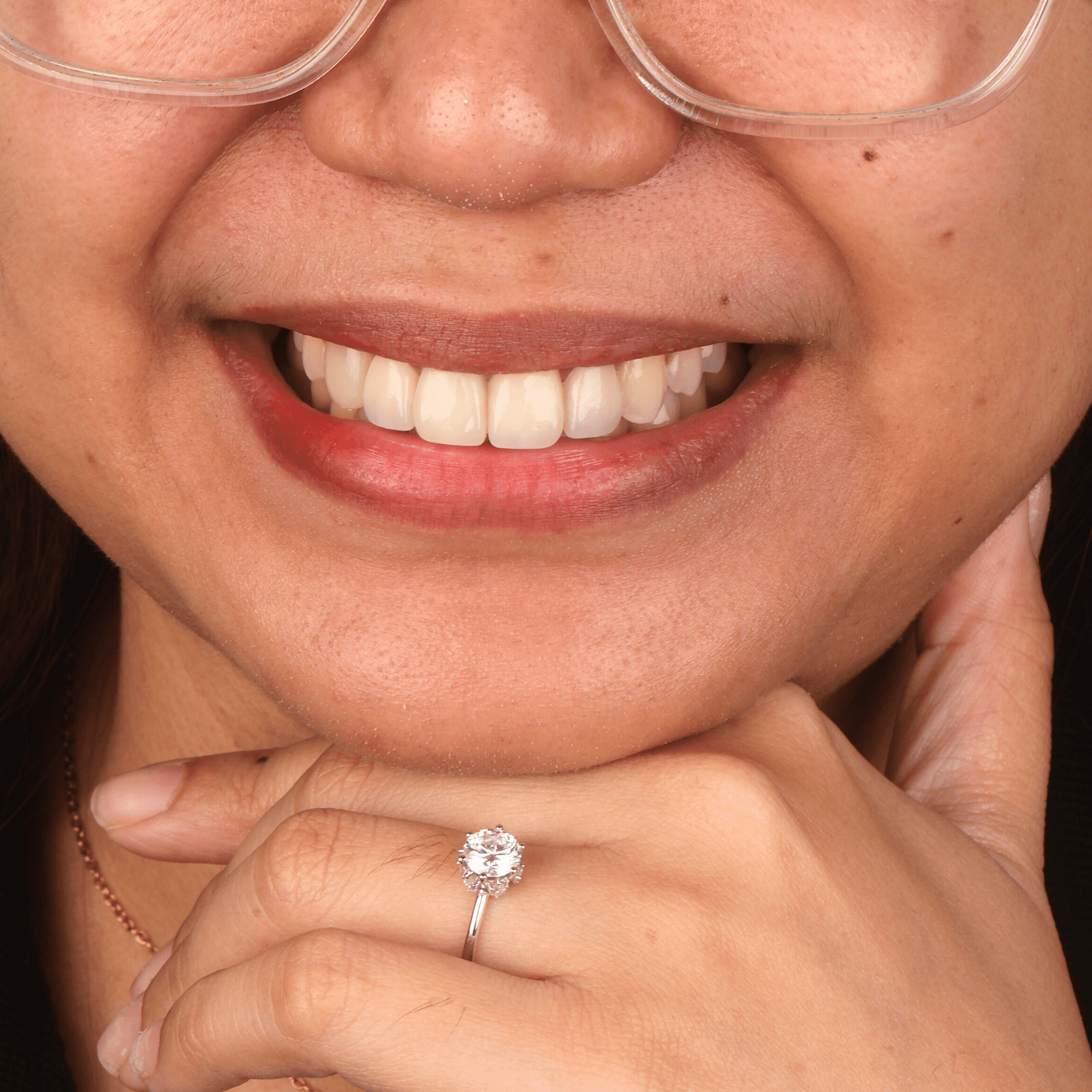 Comfortable, relaxed patient smiling after safe oral surgery, tooth extraction, and sedation dentistry at Ora Dental.