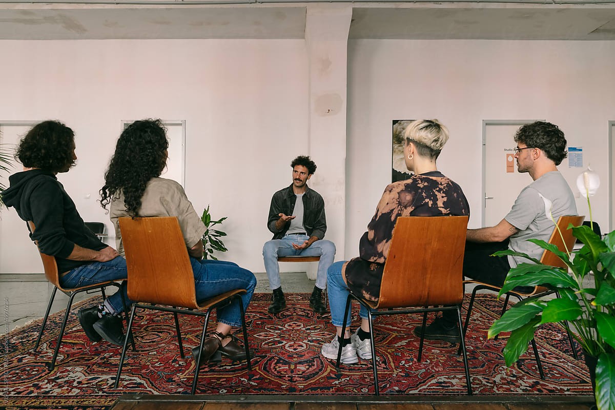 Interns in a circle discussing