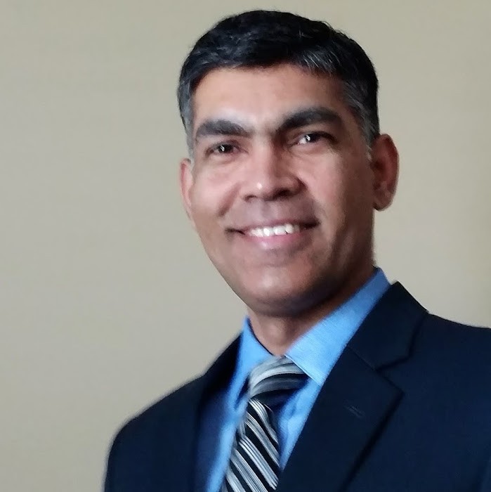 Man smiling in an office