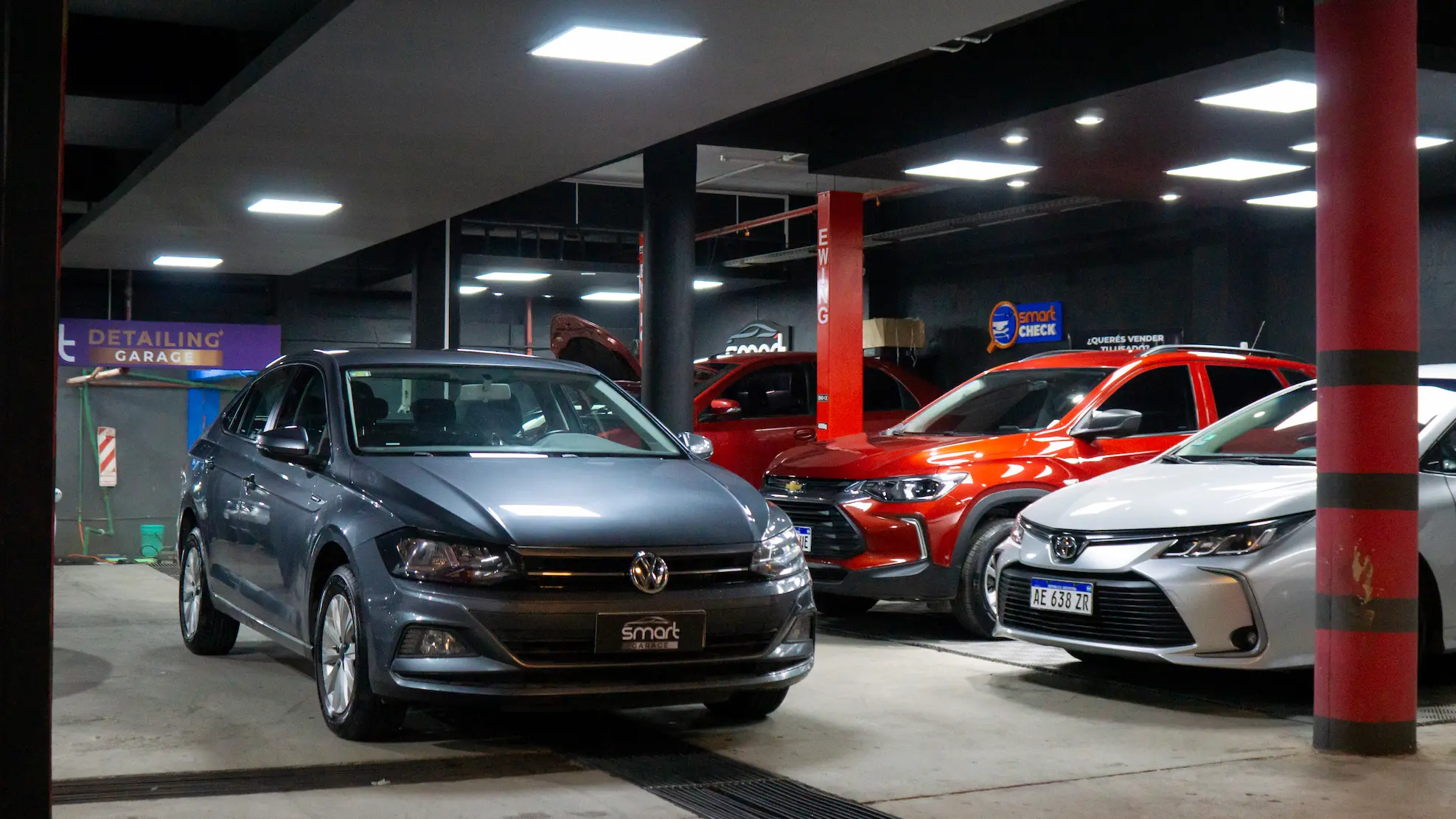 Collection of luxury sports cars displayed in modern rental showroom