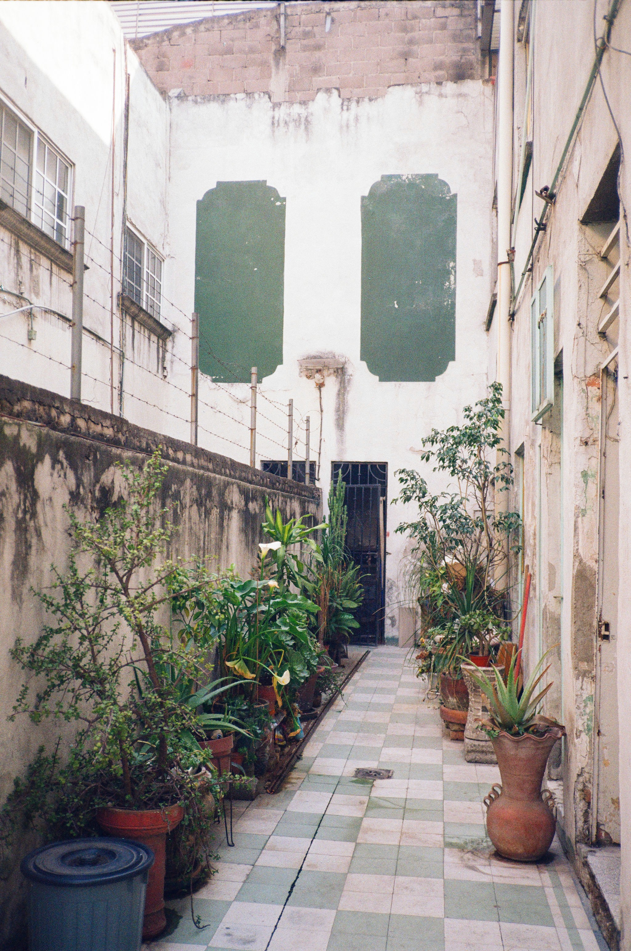 Woman walking on a curved pavement with shadow.