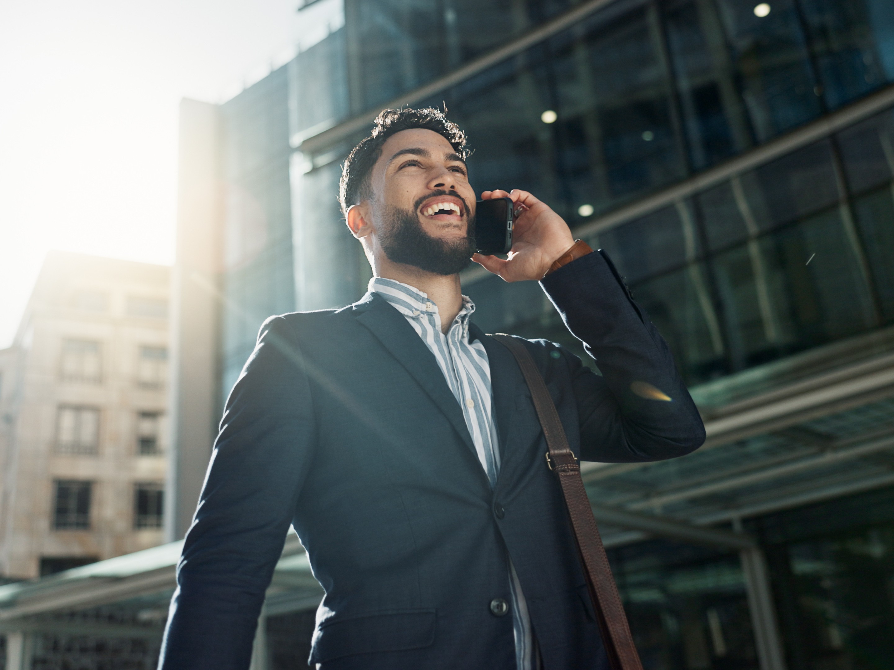 man taking a walk while on the phone to increase how many steps to take a day to lose weight