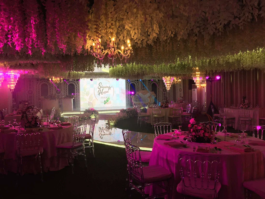 Corporate function tables in elegant pink tones inside Celestia Hall, Quezon City