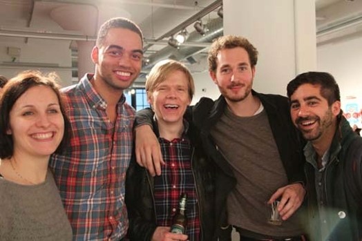 group photo of four men and one woman