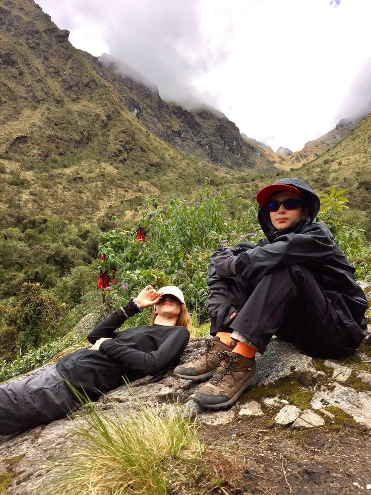 Woman in black lace dress near modern white structure