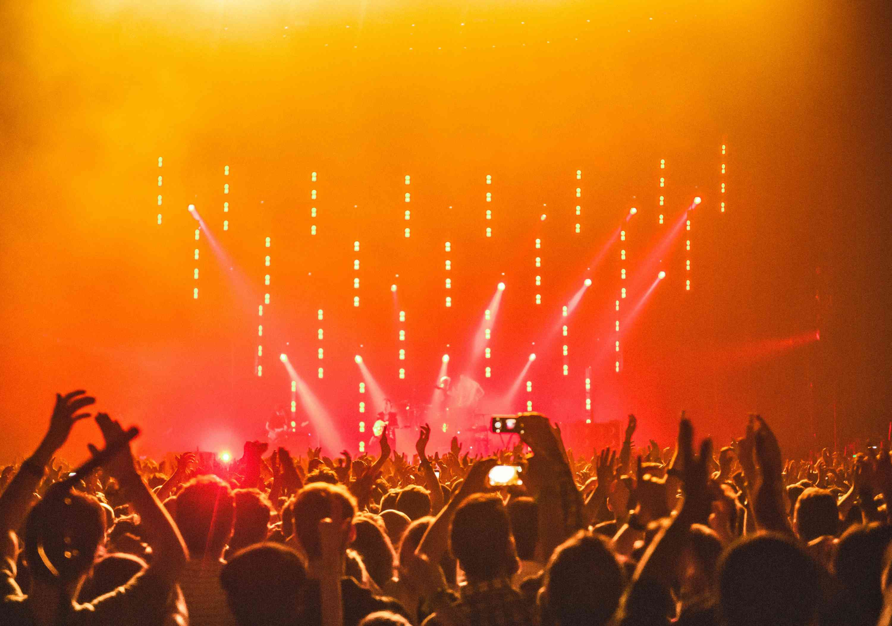 Crowd enjoying a vibrant live concert stage design with dynamic lighting effects