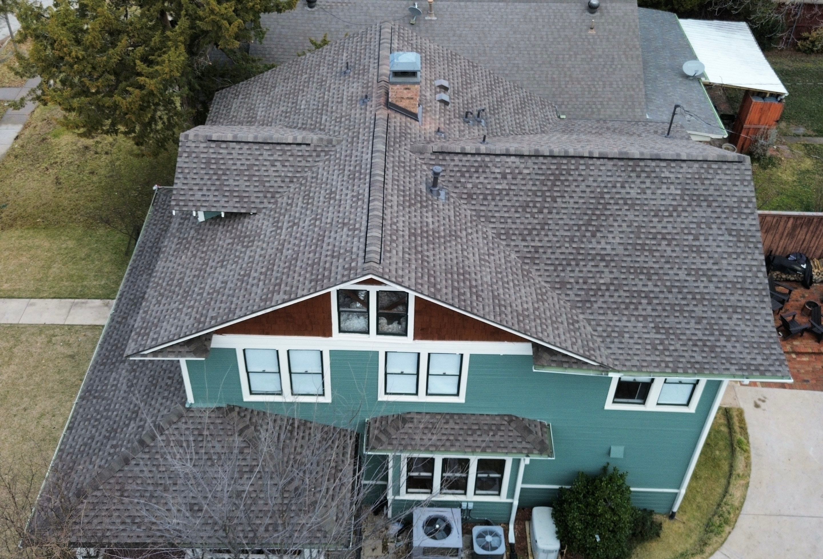 Closer aerial of the front gable, dormer, and shingle field on the Winnetka Heights craftsman home