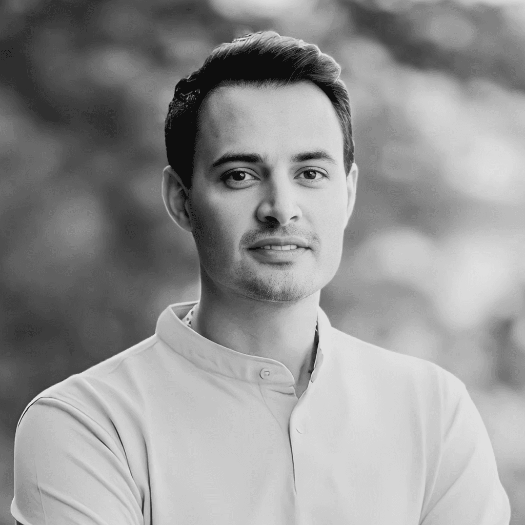 Black & white professional headshot of a male product designer