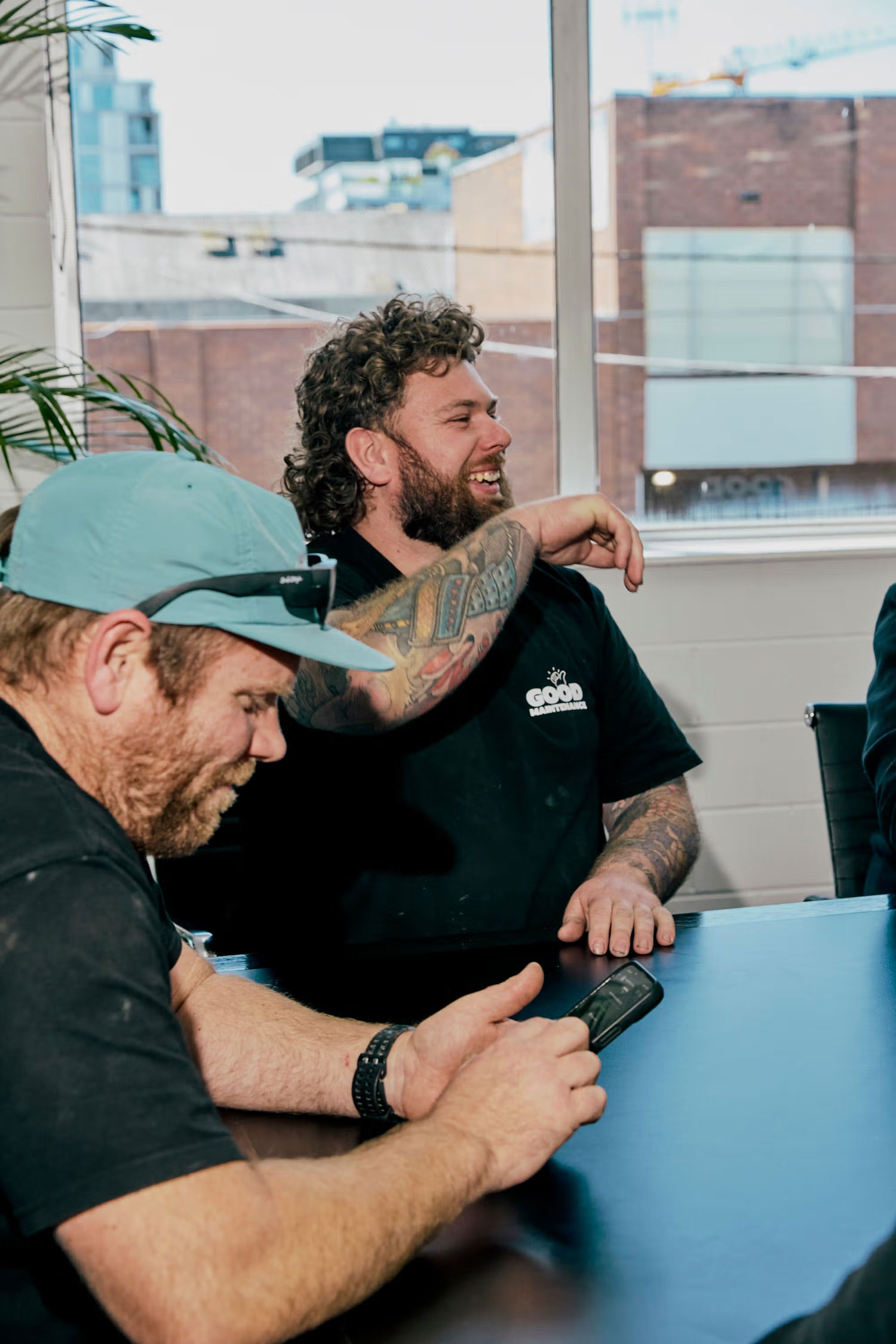 Technician organising plumbing materials on storage rack in warehouse.