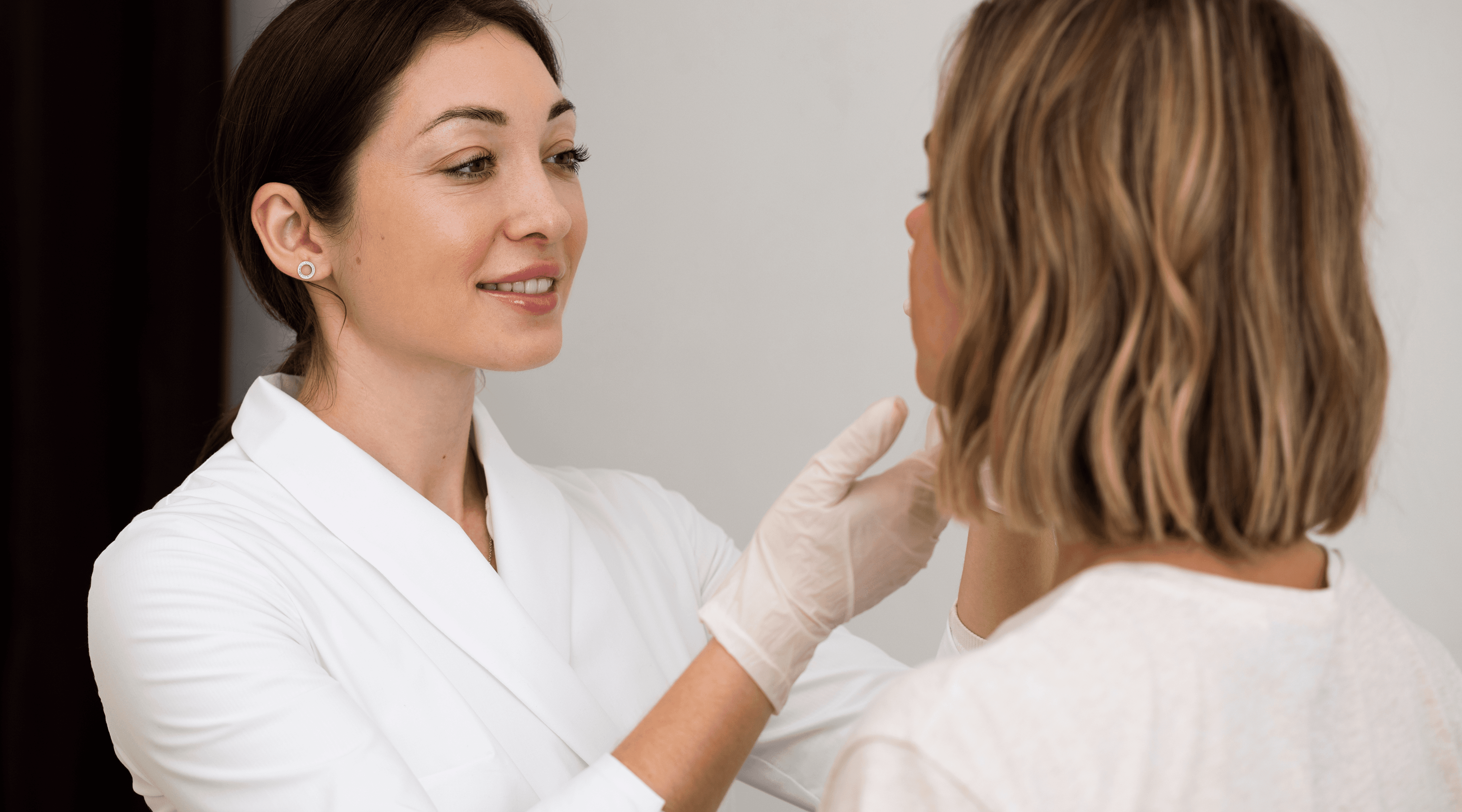 Doctor examining a patient's face.