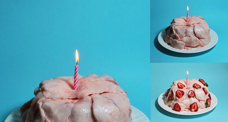 A set of three pictures with a birthday cake made from meat, put on a plate and a candle lite on it. One of the variants has strawberries all over the cake.