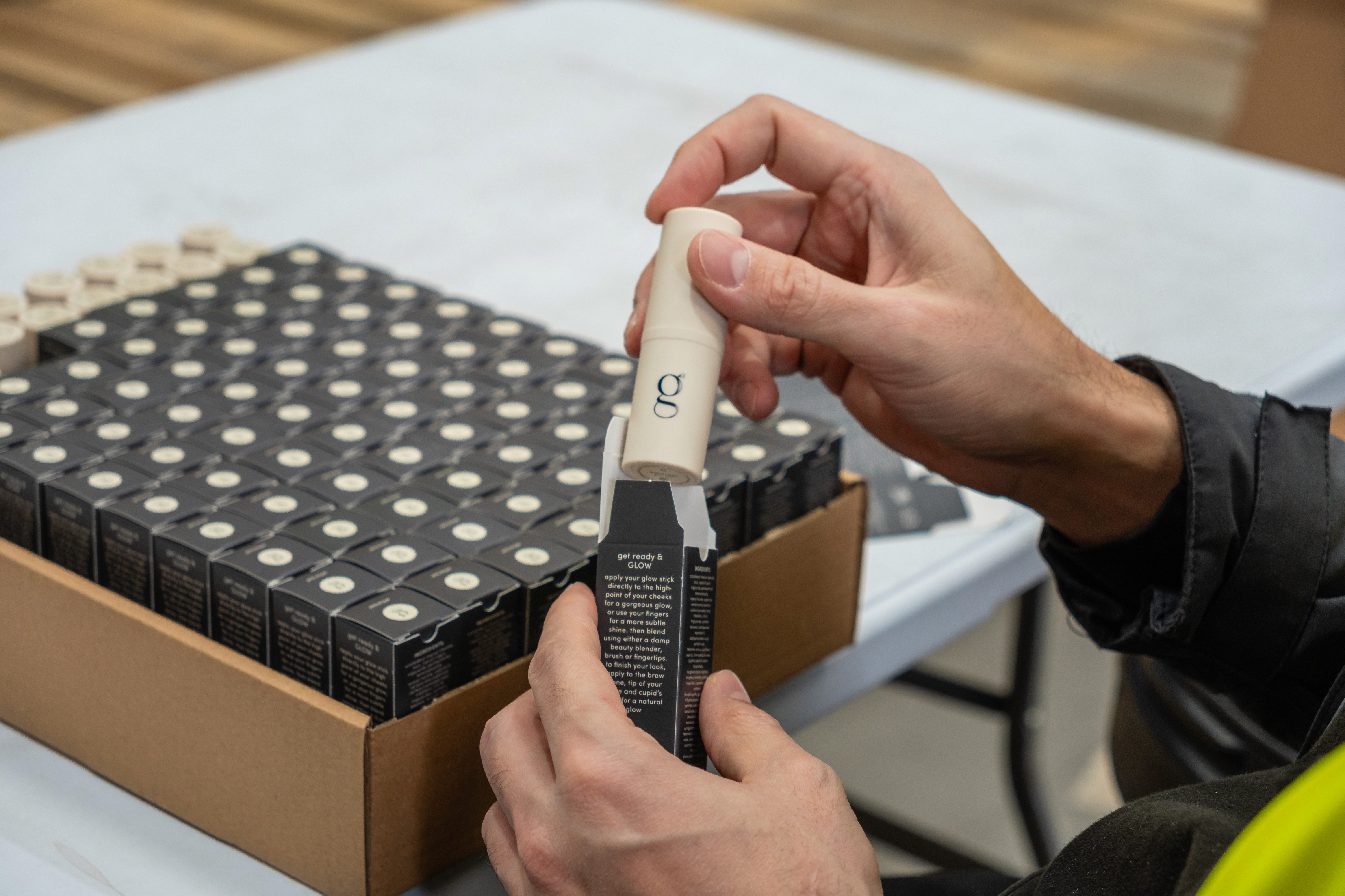 a person putting a product into a box