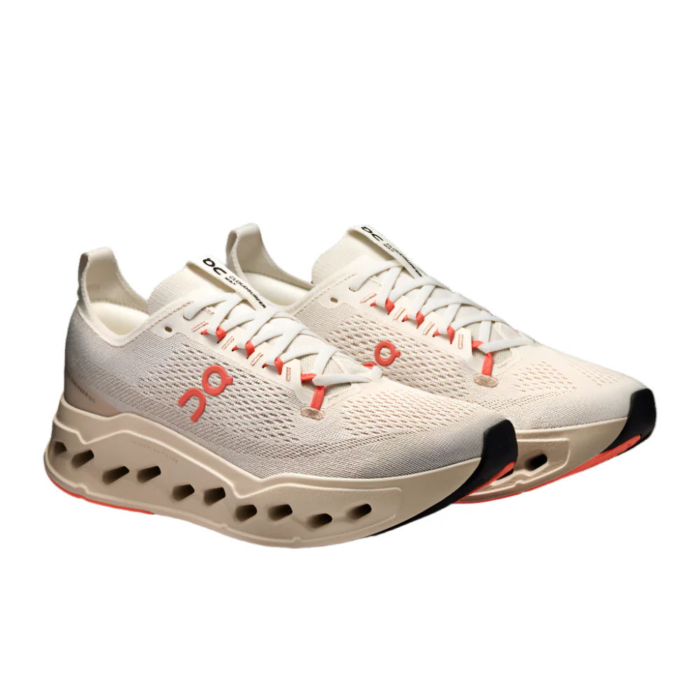 Pair of ivory/salmon Cloudsurfer Max shoes on a white background