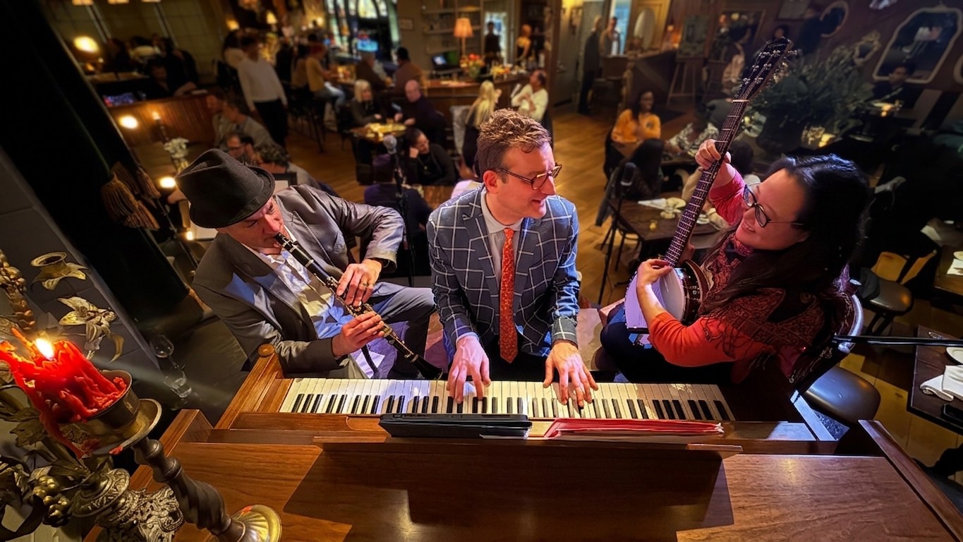 The Alex Guilbert Trio playing old time jazz on The Pink Door Stage.