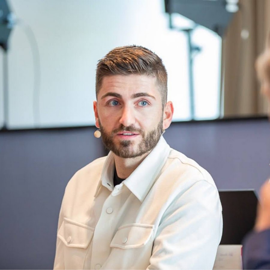 woman standing near fern plant