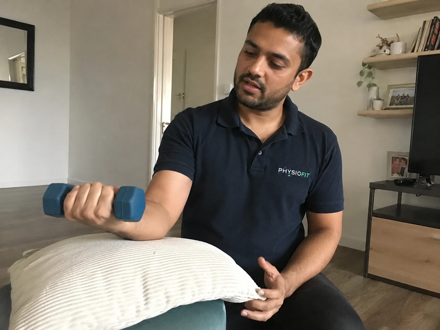 Home physiotherapy session with light dumbbell