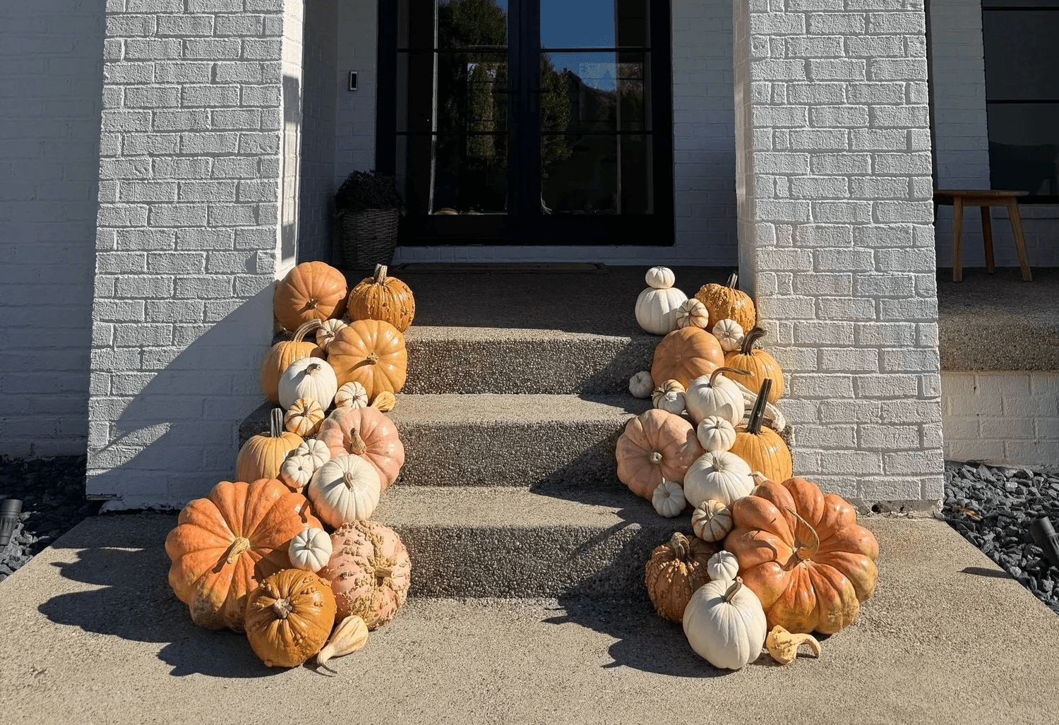 Front porch decorated with pumpkins