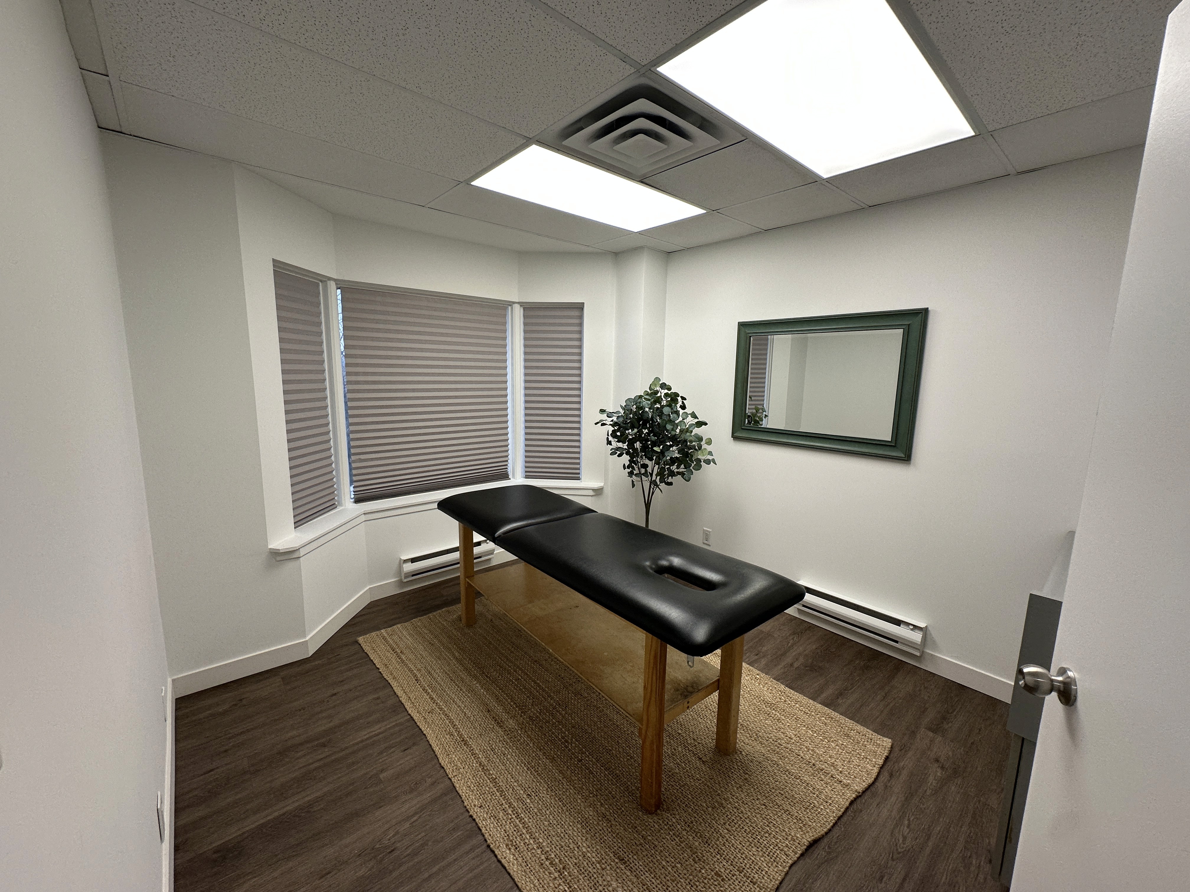 a doctor showing a patient something on the tablet