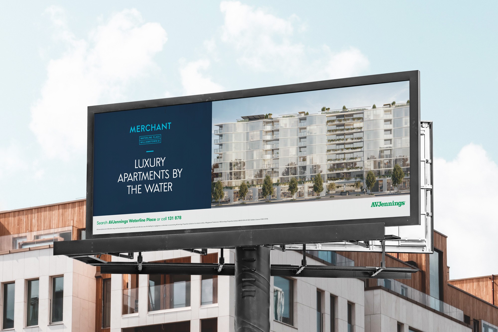 A large outdoor billboard displays an advertisement for luxury apartments by the water. The image shows a modern apartment building with sleek glass facades, set against a clear blue sky. Text on the left reads "Luxury Apartments by the Water" in bold white letters. The tone conveys sophistication and exclusivity.