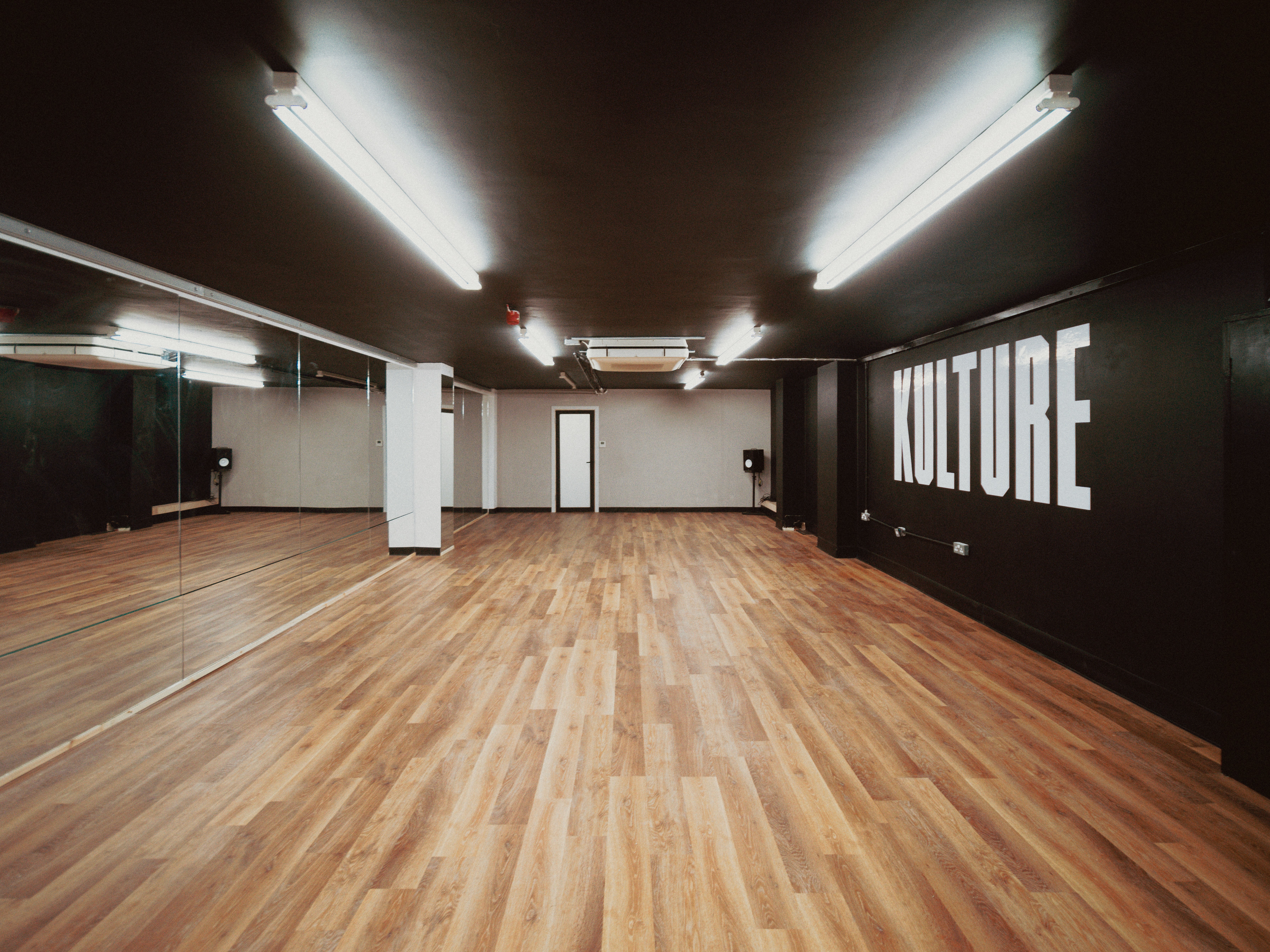 Kulture Studio Bristol open-plan room with mirrors and wooden floor