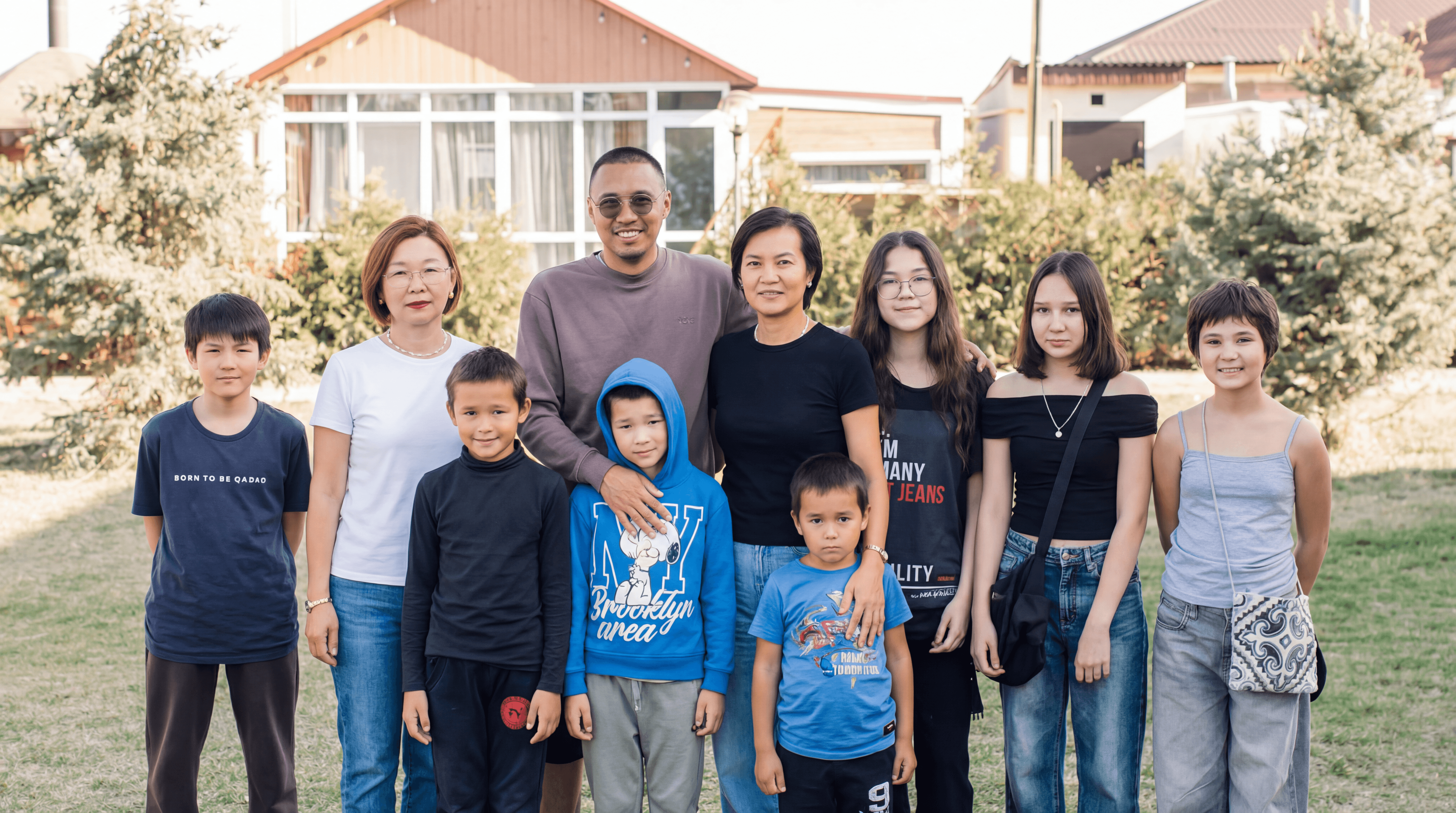 woman holding a phone and man looking at the phone. both are smiling