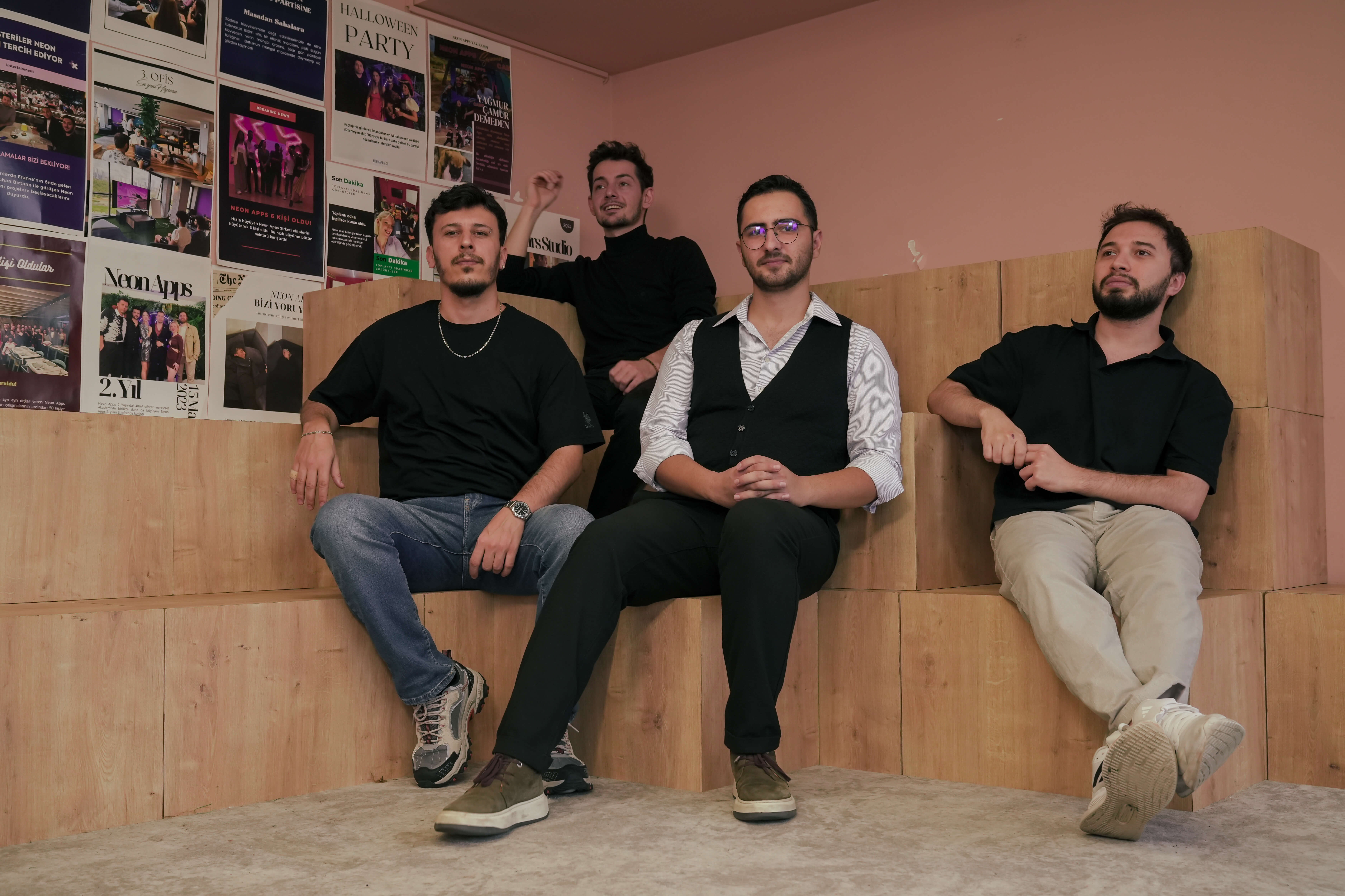 Designers and developers collaborating on new app features at Neon Apps.