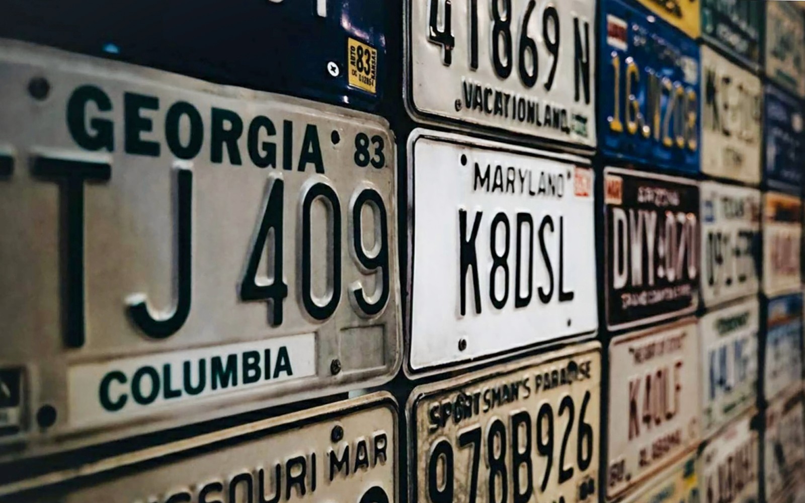 Vintage license plates display at Malta Classic Car Collection Museum.