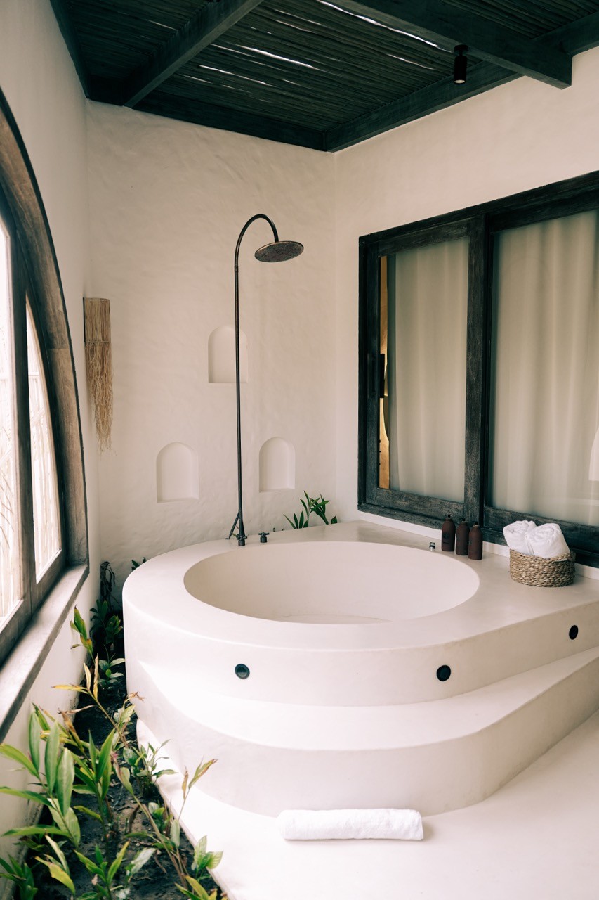 modern open lounge with palm trees outside