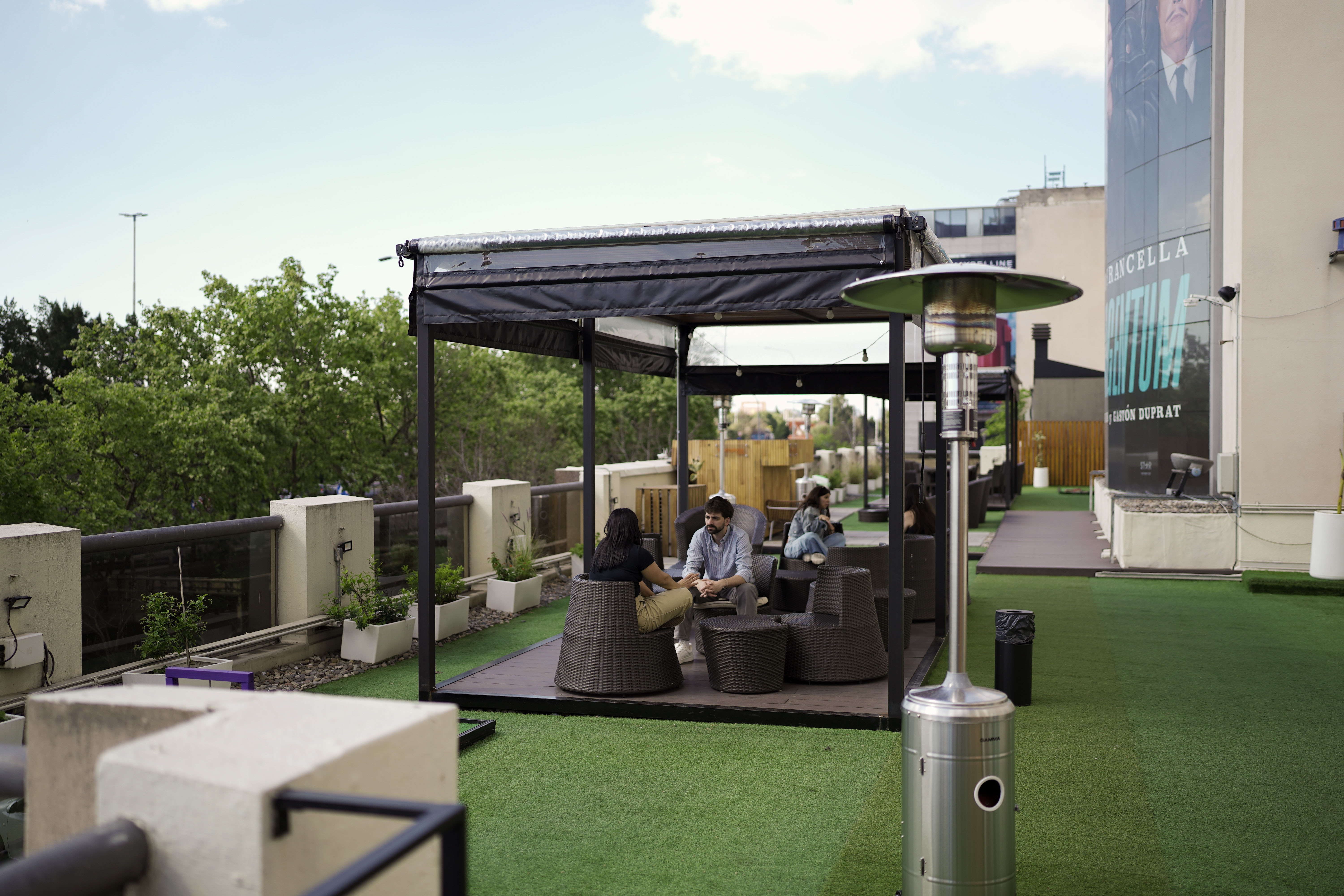 people sitting on chair near glass window during daytime