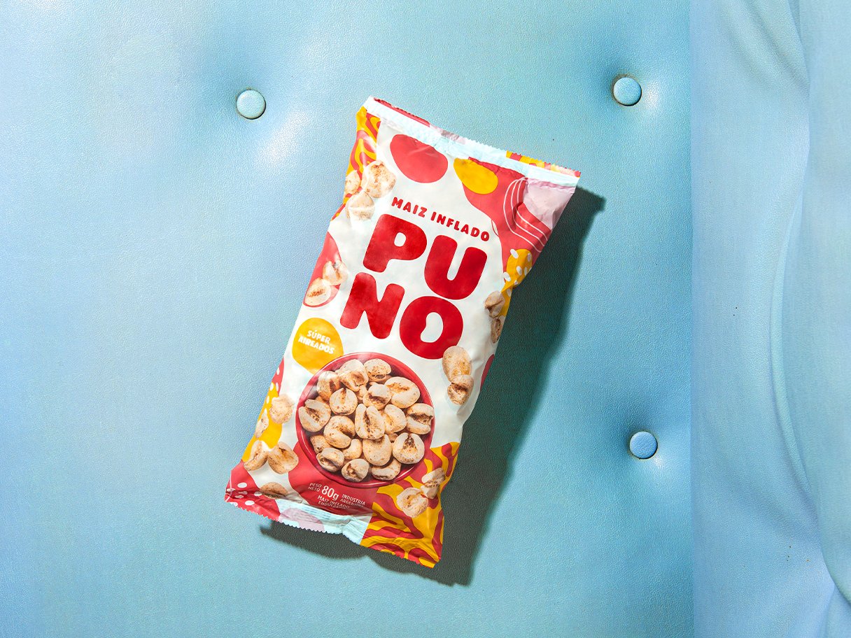 Rooftops of a coastal town with the sea in background