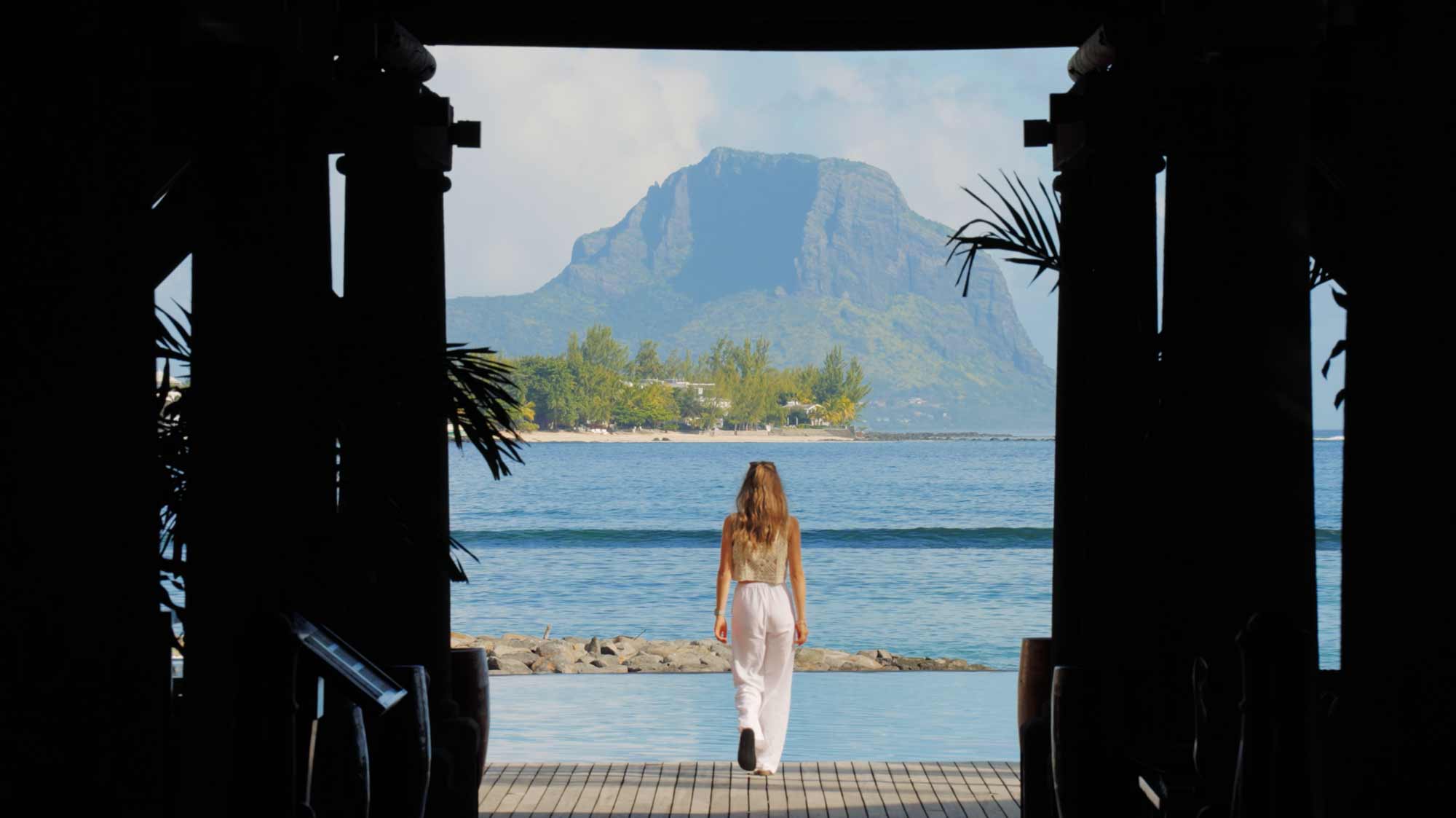 Woman facing ocean view; perfect storytelling for hotel in mauritius
