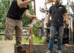 Technicians drilling a water well