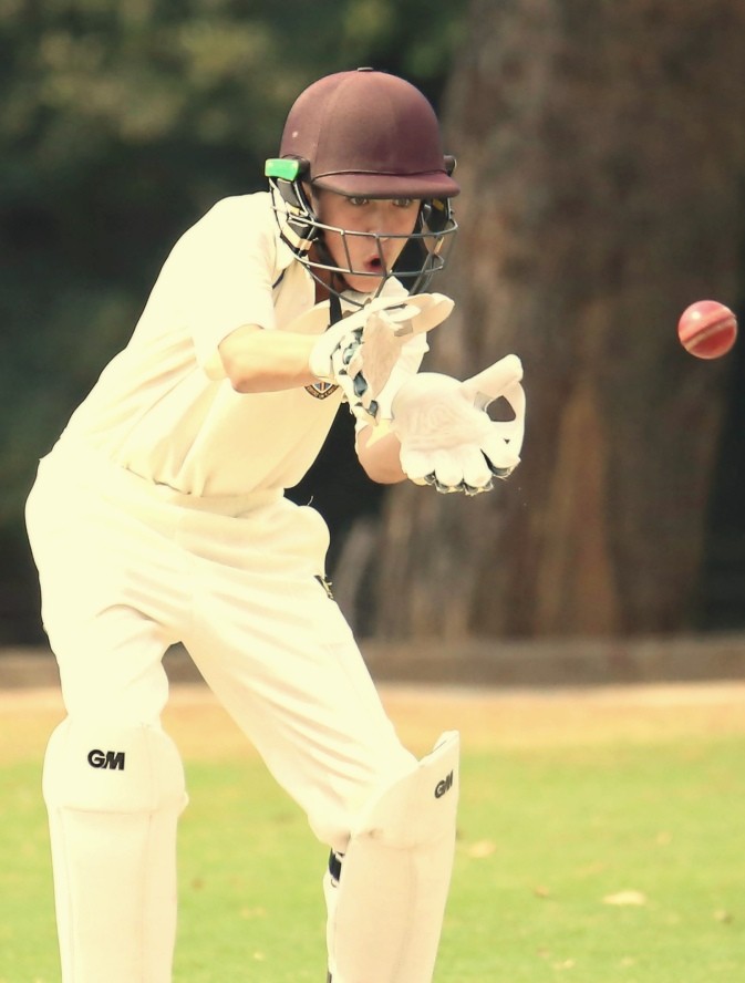 Wicket-keeper taking the ball