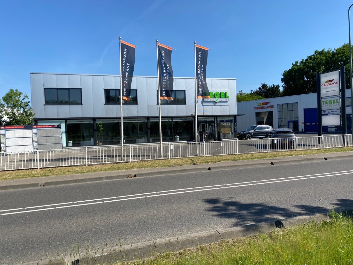 Modern living room with vertical garden, yellow sofas, and stylish coffee tables.