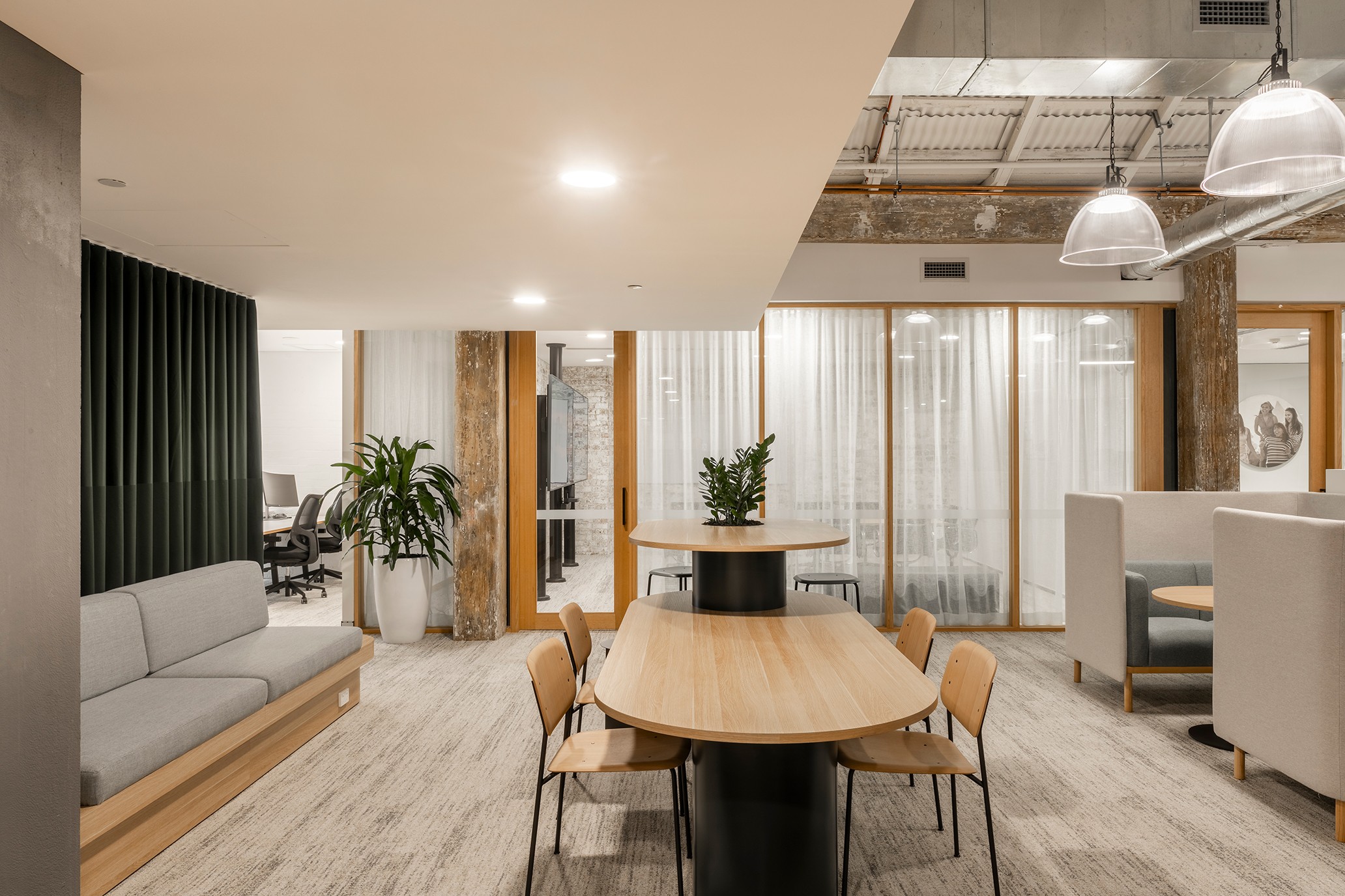 Photo of modern office space showing tables and chairs