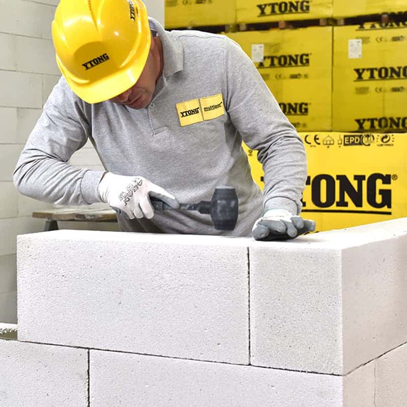 a tall building with a blue sky