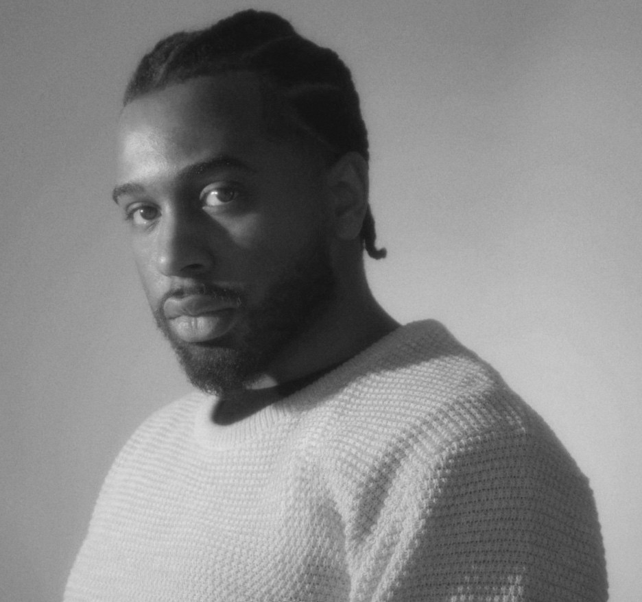 a blurry photo of a person standing in front of a wall