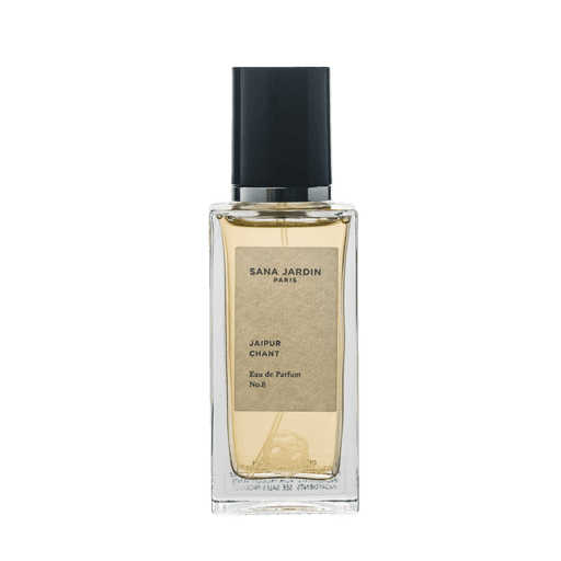 Sana Jardin luxury perfume bottle topped with a custom black VIVOMER perfume cap. A premium, plastic-free cosmetic closure that provides high-end tactile performance for retail beauty shelves.