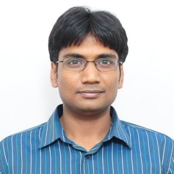 a man in a blue suit posing for a picture