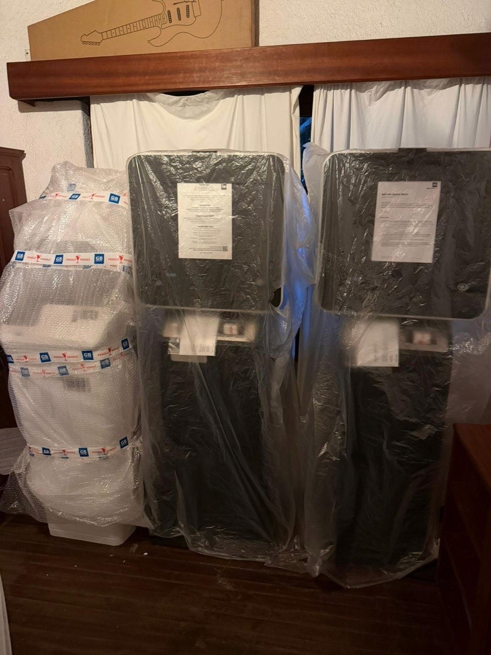 Uninstalled Bitcoin ATMs wrapped in plastic packaging in Goma, DRC, awaiting deployment by Bridge Sats and BTC ATM Africa