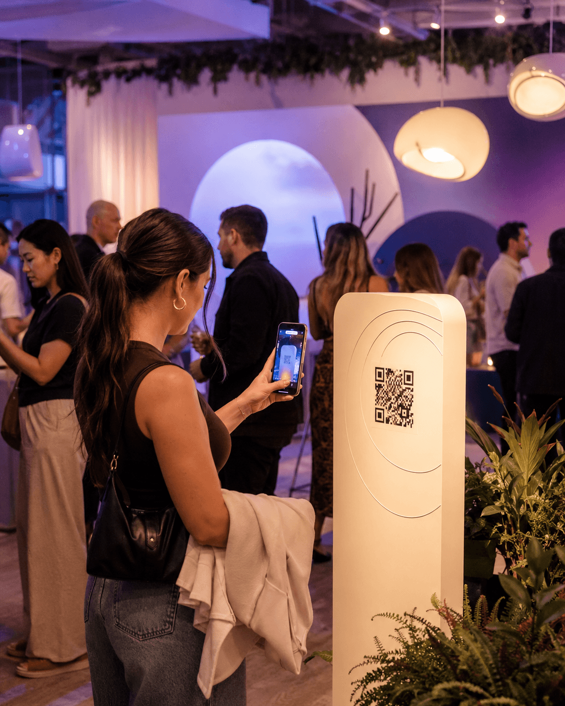 Person scanning a QR code at an indoor event venue