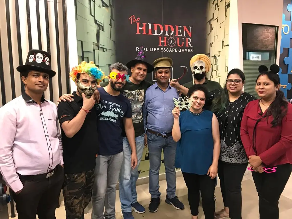 Employees enjoying a fun corporate outing at an escape room in Gurugram