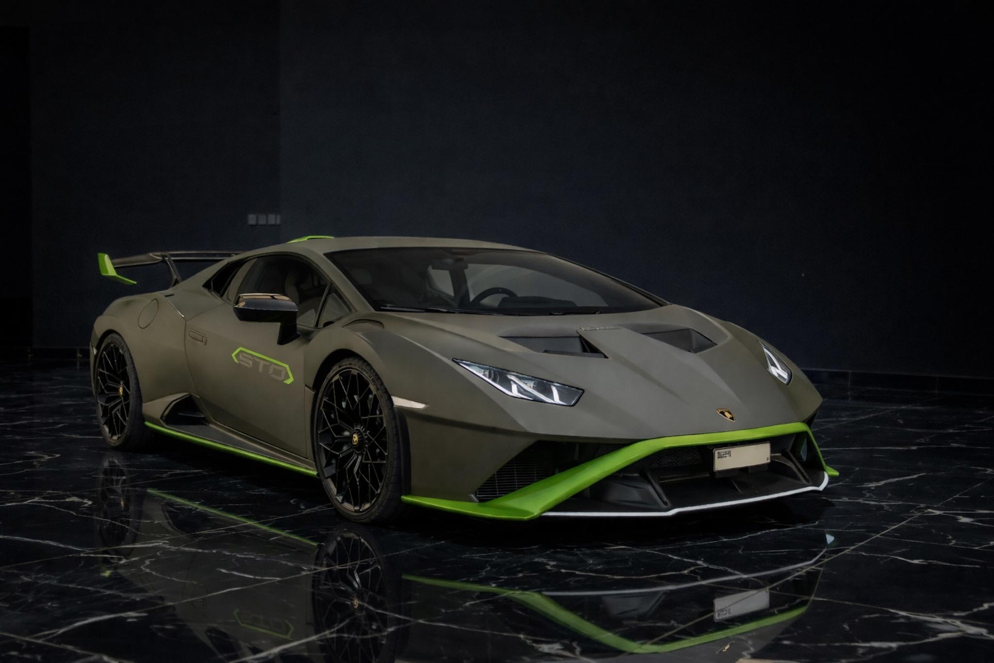 Lamborghini Huracán STO 2022 green front three quarter exterior by Queen of Supercar Rental Dubai